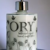 ORY Floral Elegance Portrait glass bottle with botanical line art flowers and butterflies, handcrafted for personalized skincare lotions and oils.