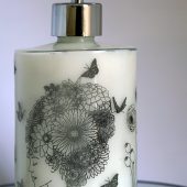 ORY Floral Elegance Portrait glass bottle featuring an illustrated female profile with botanical floral hair and butterflies, designed for personalized skincare oils and lotions.
