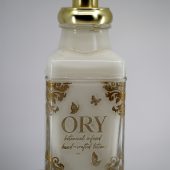 ORY rococo-style personalized glass lotion bottle with gold baroque detailing, elegant butterfly accents, and luxury gold pump for custom engraving.