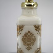 ORY rococo-style personalized glass lotion bottle with ornate gold baroque motif, polished gold pump, and luxury engraving-ready design.