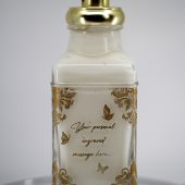 ORY personalized rococo-style glass lotion bottle with gold pump, ornate baroque floral detailing, and custom engraved message.