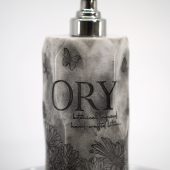 ORY Midnight Garden marble lotion bottle with silver pump, featuring floral illustration and butterfly motif on a handcrafted botanical-infused skincare container.