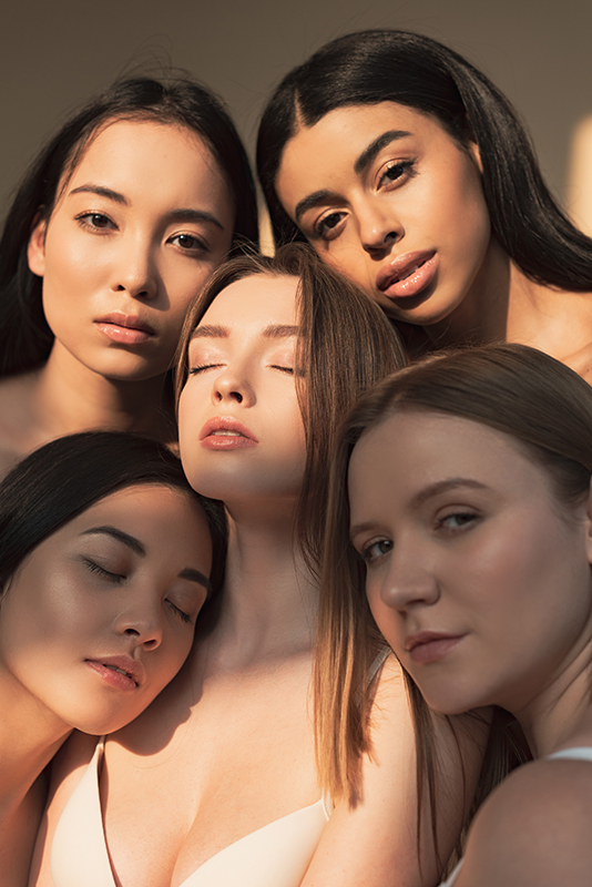 Diverse women with radiant skin in soft natural light, representing ORY Skincare’s emulsifier science that harmonizes oil and water for balanced, healthy skin.