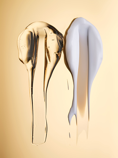 Transparent gel and creamy emulsion textures displayed side by side, illustrating oil-and-water interaction in emulsifier science for advanced skincare formulations.