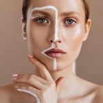 Woman with combination skin applying targeted serum treatment to T-zone and dry areas — ORY Skincare balancing serum for combination skin.”