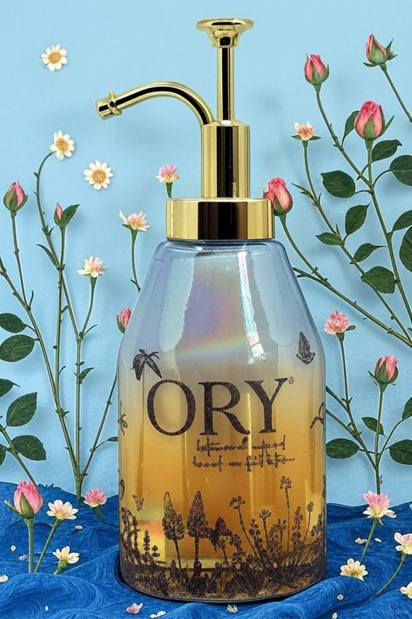 Elegant personalized ORY botanical infused hand and body lotion bottle with pump dispenser, featuring leaf and butterfly designs on floral background, showcasing Oryskincare's custom natural skincare solutions for nourished, hydrated skin.